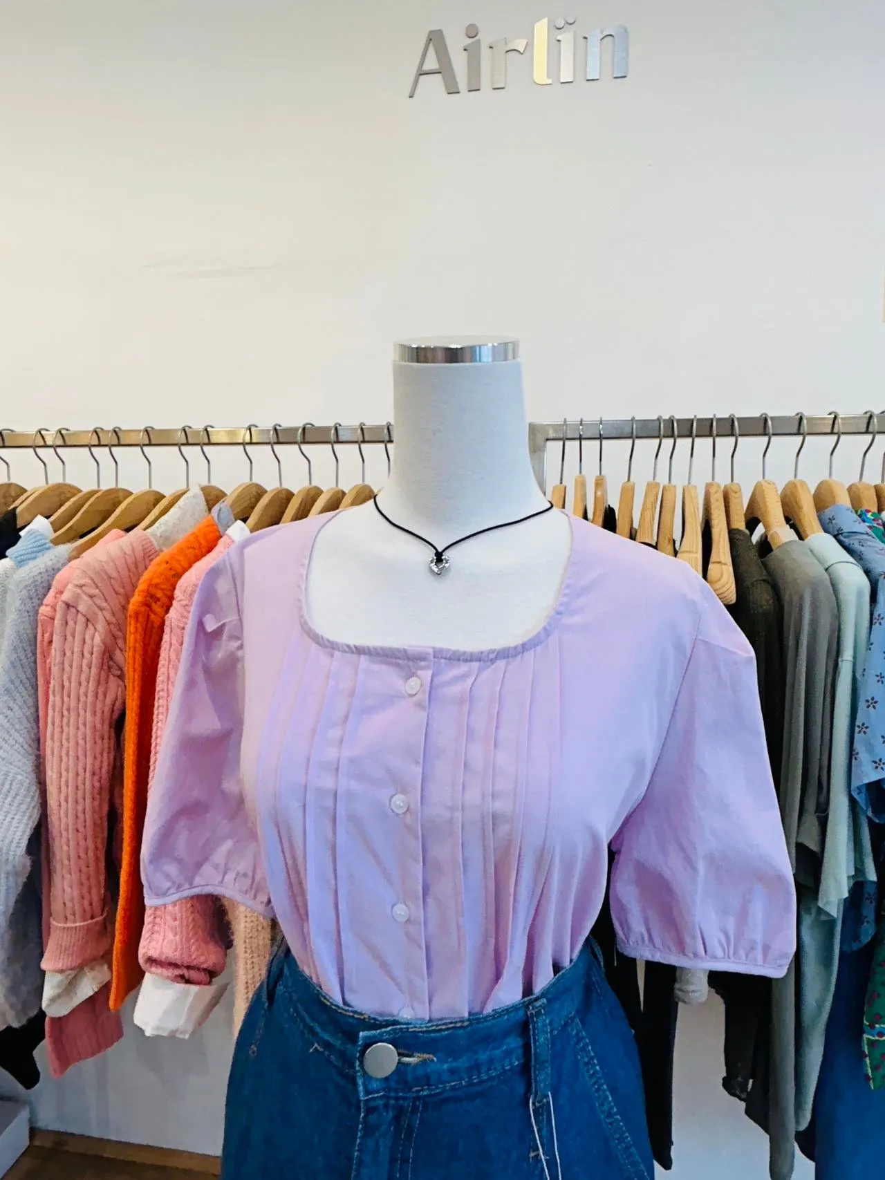 A square-necked lavender shirt