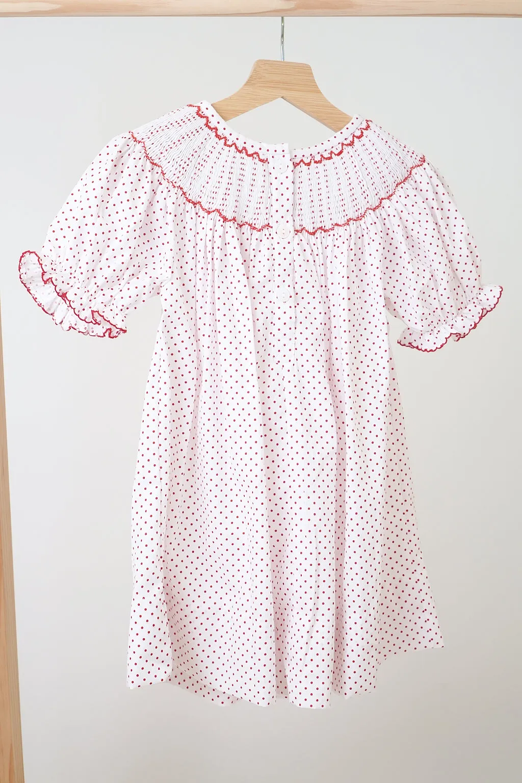 Pink christmas bishop hand smocked dot dress